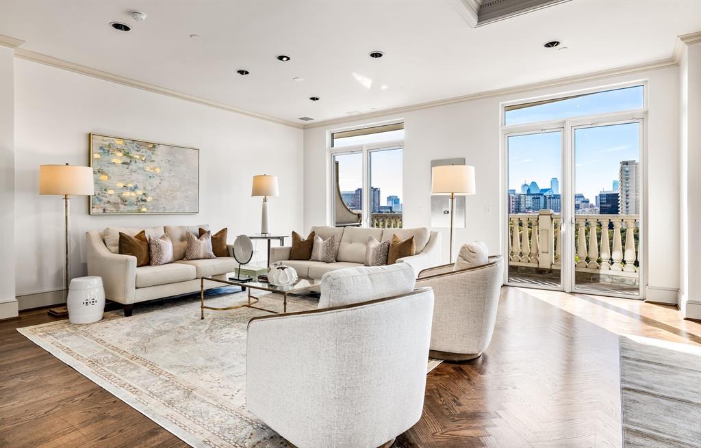 3505 Turtle Creek Boulevard, Unit 8B Dallas, TX 75219 - Photo 1 of 1 a living room with furniture and a table