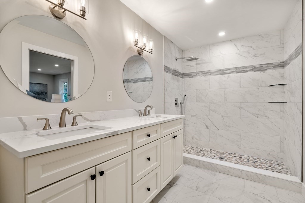 4 Emmeline Path, Unit 4 Wayland, MA 01778 - Photo 8 of 14 a bathroom with double sink and a mirror