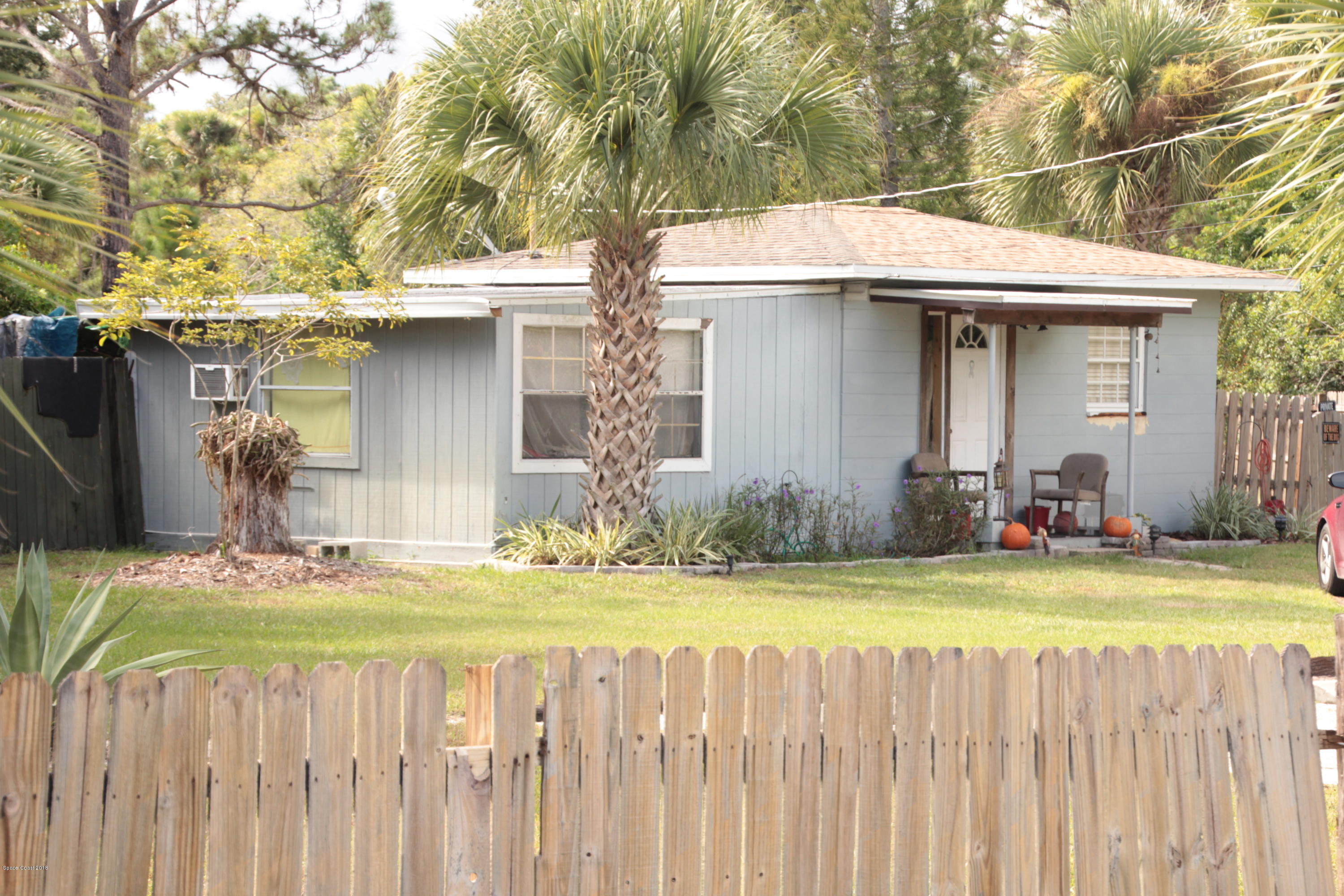 5308 Riveredge Drive Titusville, FL 32780 - Photo 1 of 25 a view of a house with backyard and wooden fence