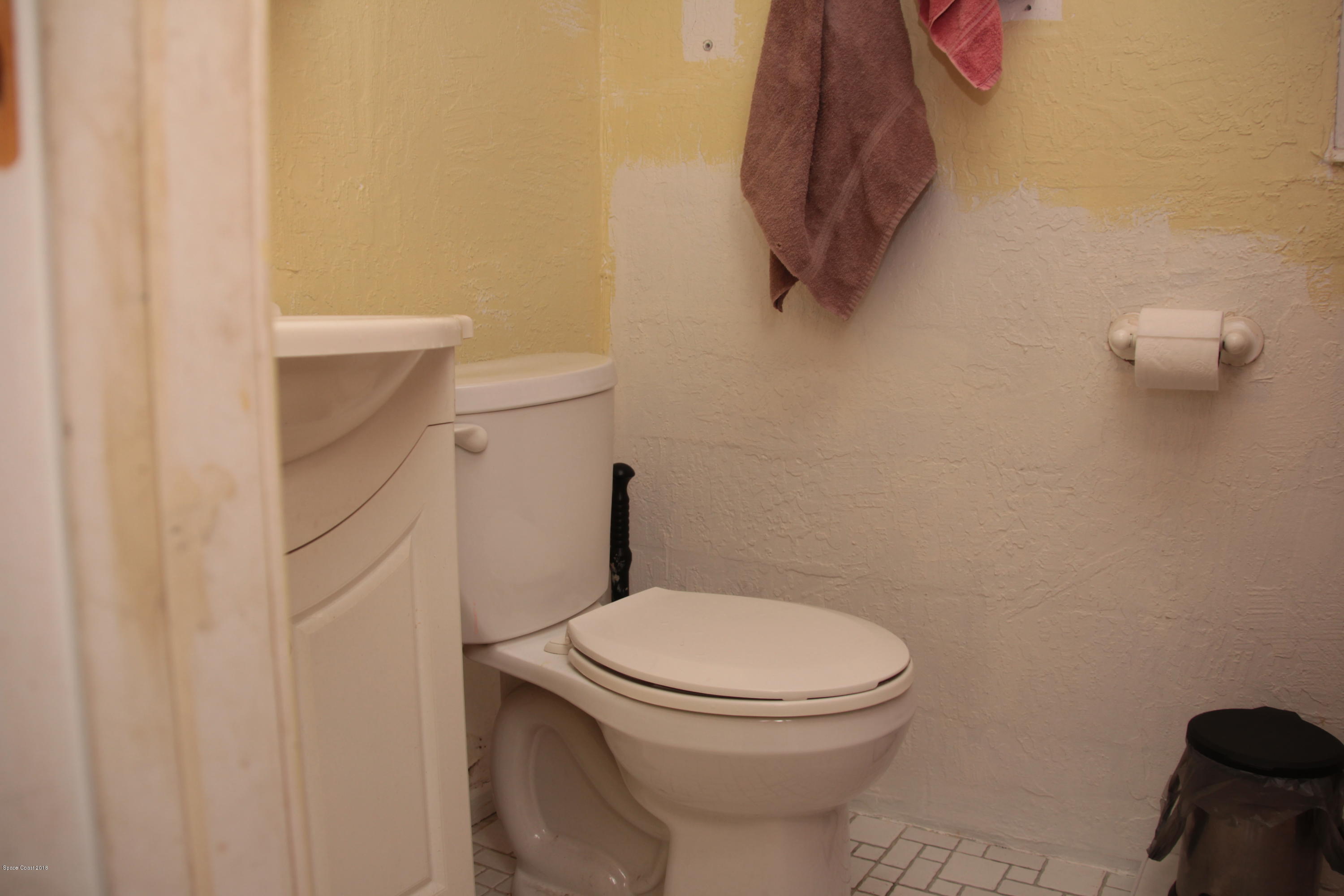 5308 Riveredge Drive Titusville, FL 32780 - Photo 12 of 25 a bathroom with a toilet and a sink