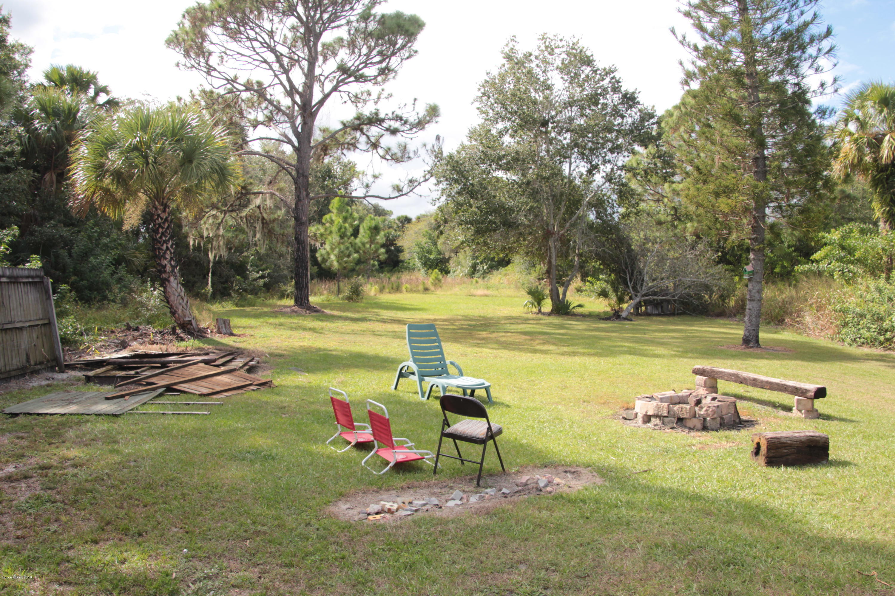 5308 Riveredge Drive Titusville, FL 32780 - Photo 19 of 25 a view of a lake with a yard