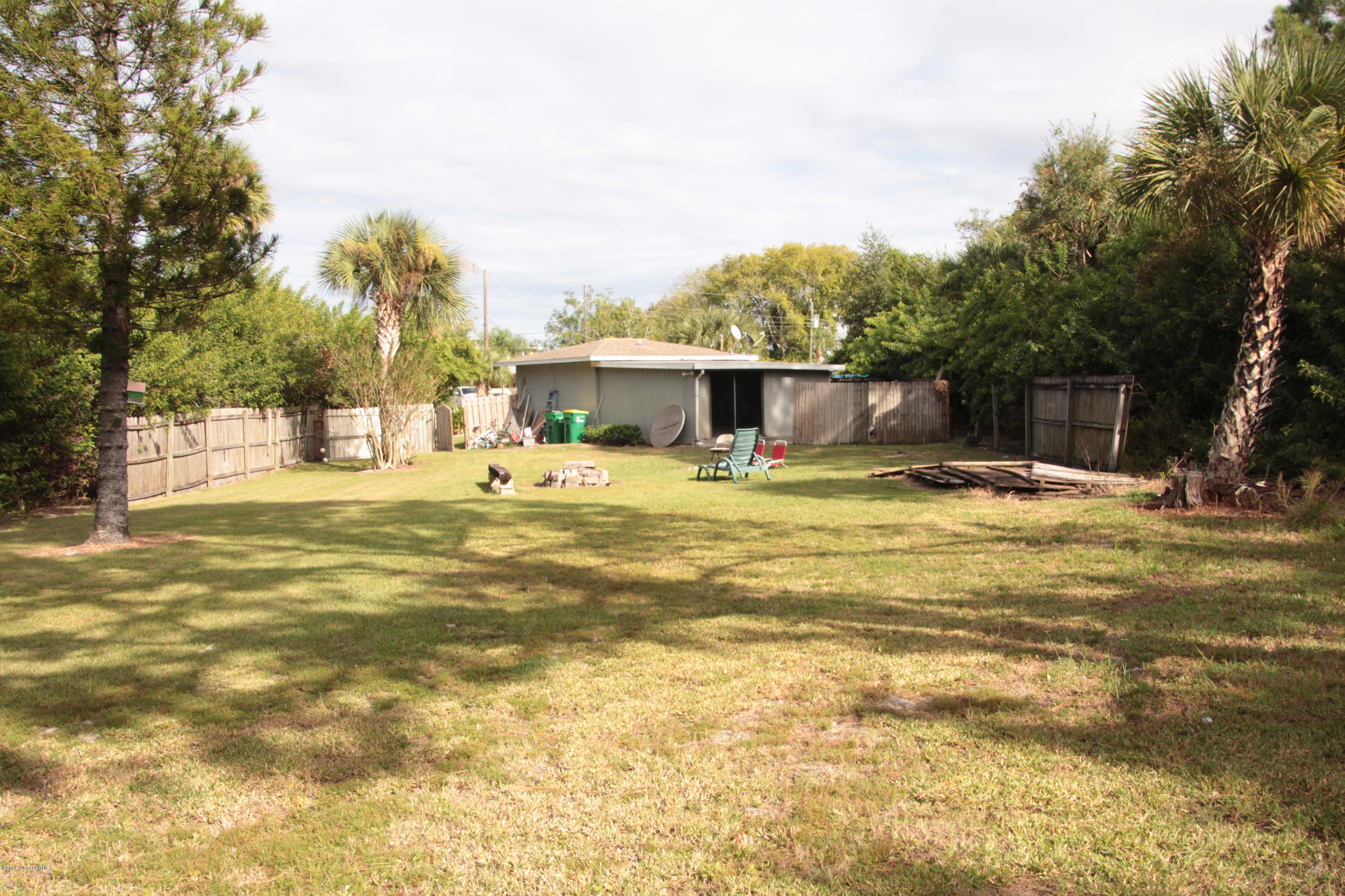 5308 Riveredge Drive Titusville, FL 32780 - Photo 25 of 25 a view of a swimming pool with an outdoor seating