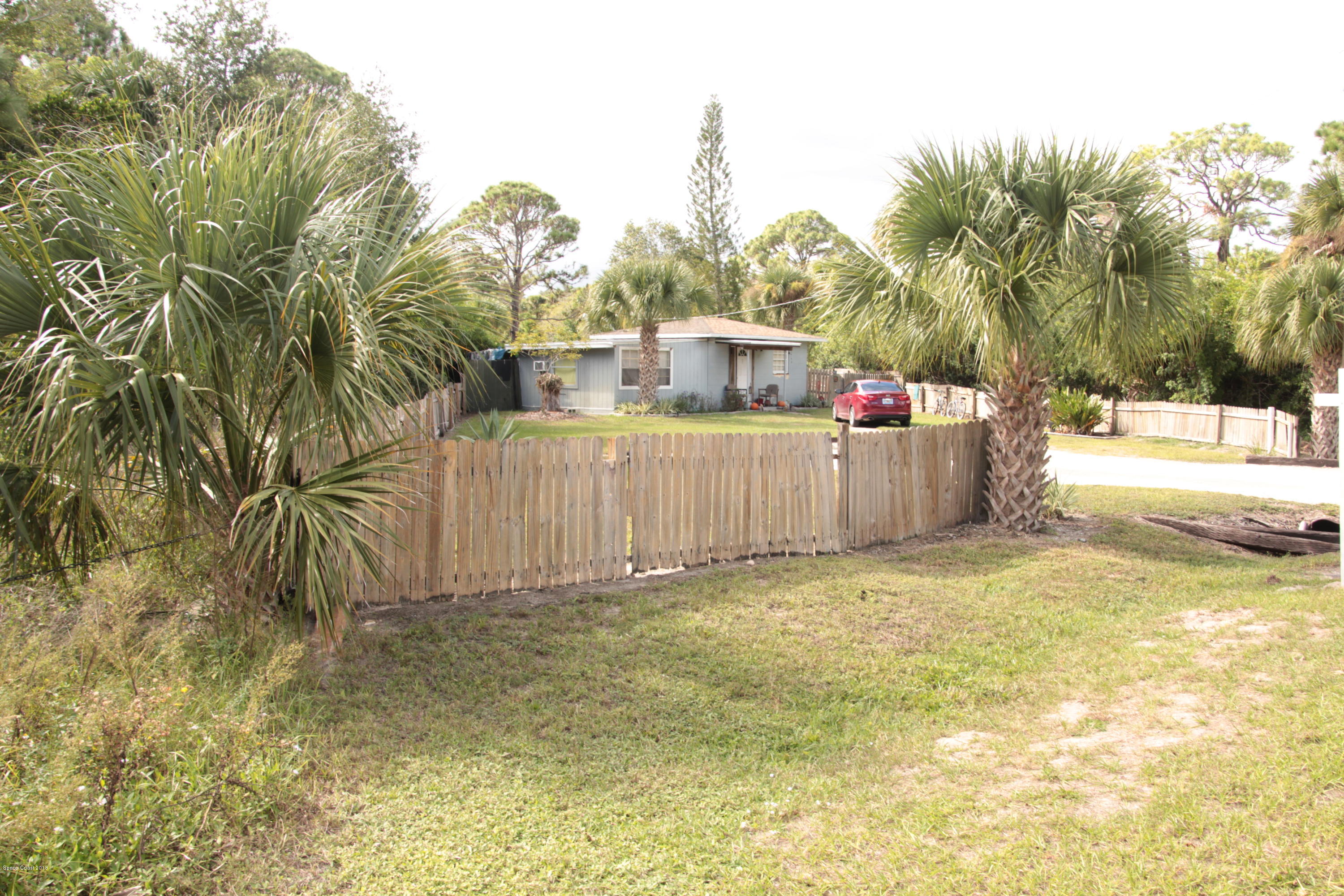 5308 Riveredge Drive Titusville, FL 32780 - Photo 4 of 25 a view of a backyard with trees