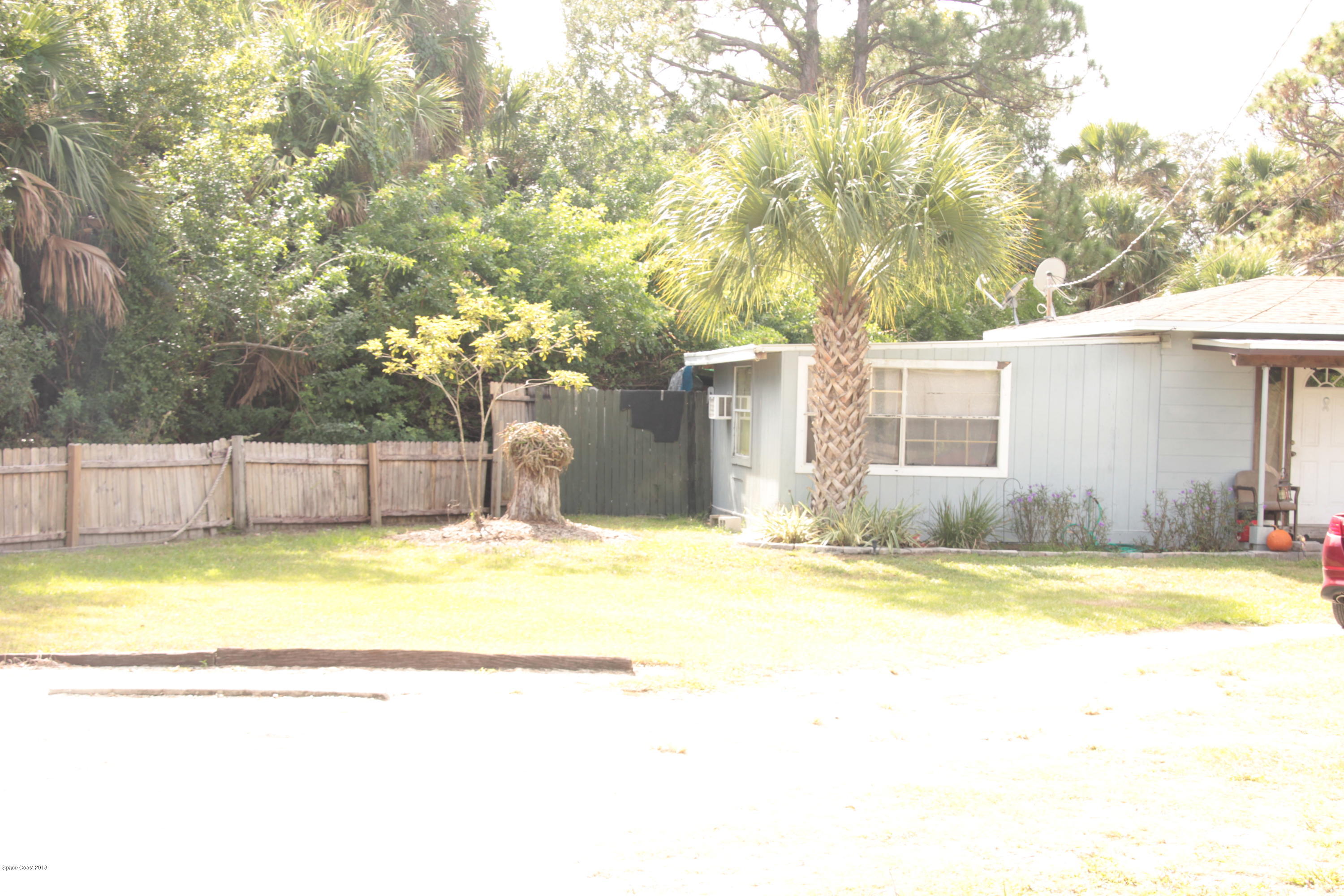 5308 Riveredge Drive Titusville, FL 32780 - Photo 6 of 25 a view of a house with swimming pool and a yard