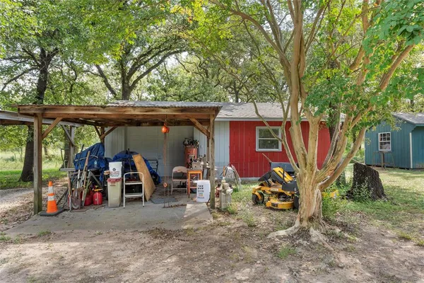 a backyard of a house with plants and garden