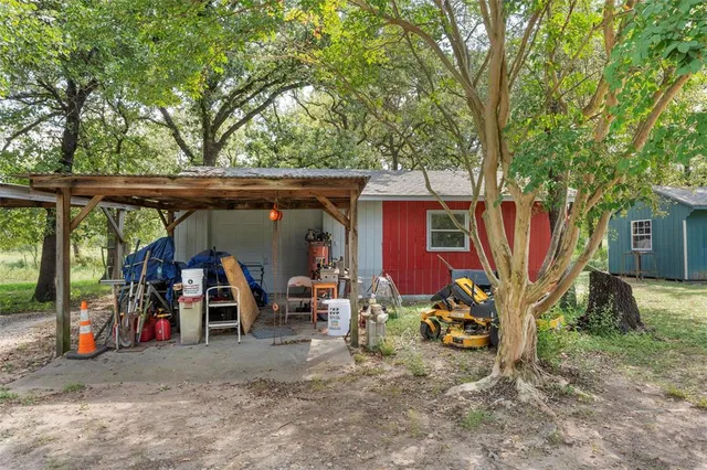 a backyard of a house with plants and garden