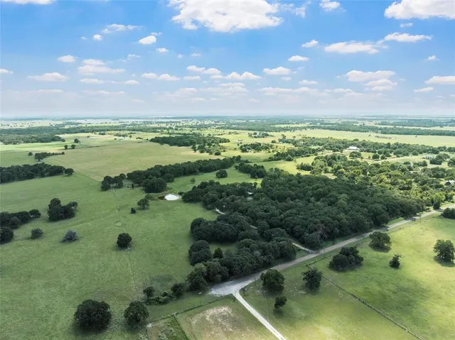 a view of a swimming pool and an outdoor seating