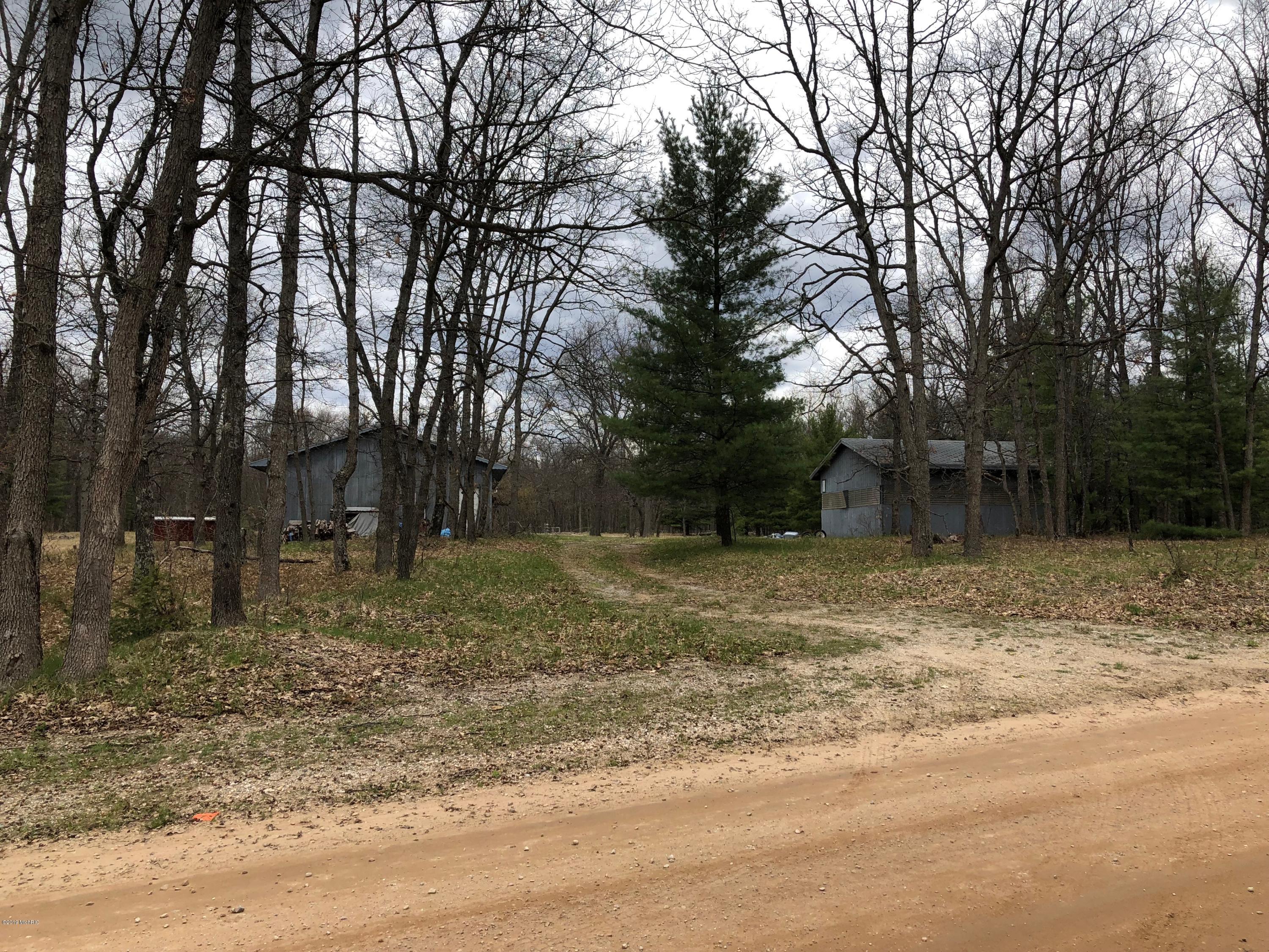 6 6 Mile Bridge Road Manistee, MI 49660 - Photo 1 of 11 2 Barns on 16.56 acres