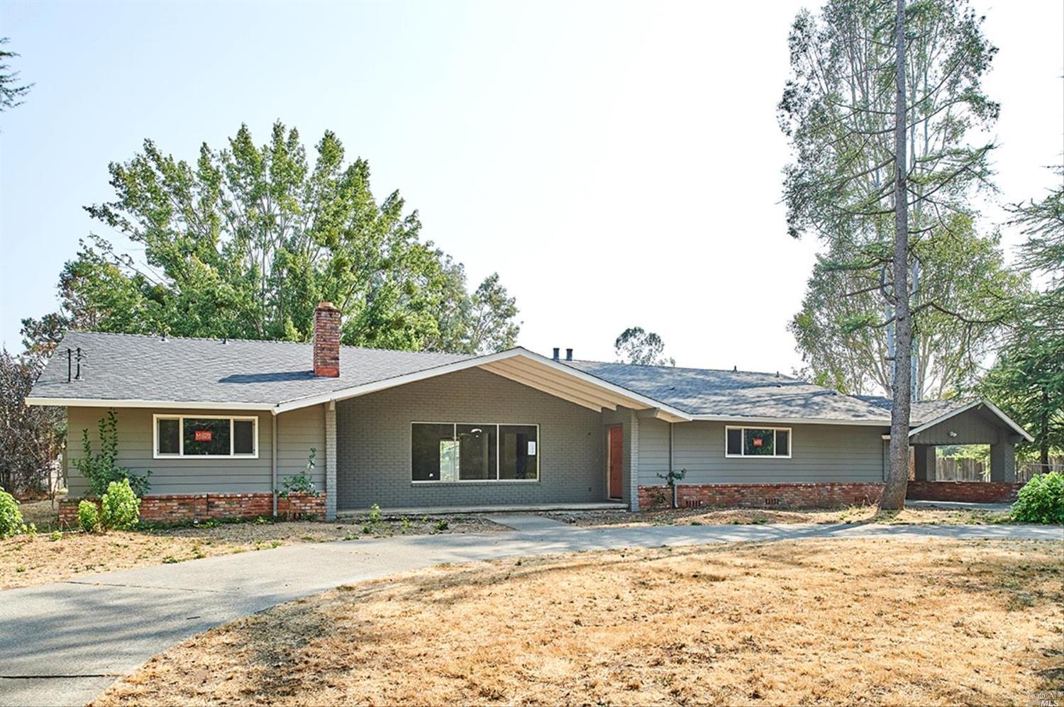 2170 Floral Way Santa Rosa, CA 95403 - Photo 1 of 1 a front view of a house with a yard