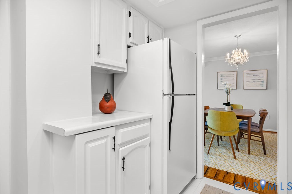 2956 Hathaway Road, Unit U704 Richmond, VA 23225 - Photo 5 of 42 Kitchen area featuring white cabinetry, a light-to