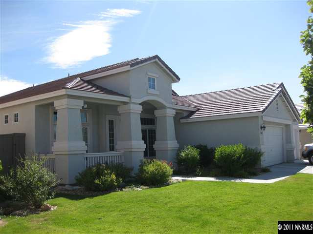 1610 Caliterra Way Reno, NV 89521 - Photo 1 of 13 a front view of a house with a yard and garage