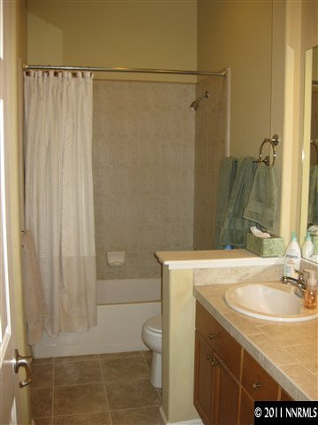 1610 Caliterra Way Reno, NV 89521 - Photo 11 of 13 a bathroom with a sink a toilet and shower