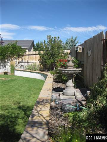 1610 Caliterra Way Reno, NV 89521 - Photo 12 of 13 a view of a backyard with sitting area