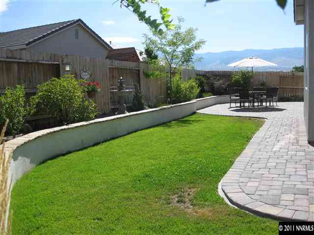 1610 Caliterra Way Reno, NV 89521 - Photo 13 of 13 a swimming pool with outdoor seating and garden