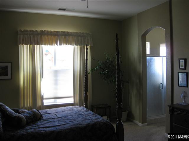 1610 Caliterra Way Reno, NV 89521 - Photo 7 of 13 a bedroom with a bed and a window