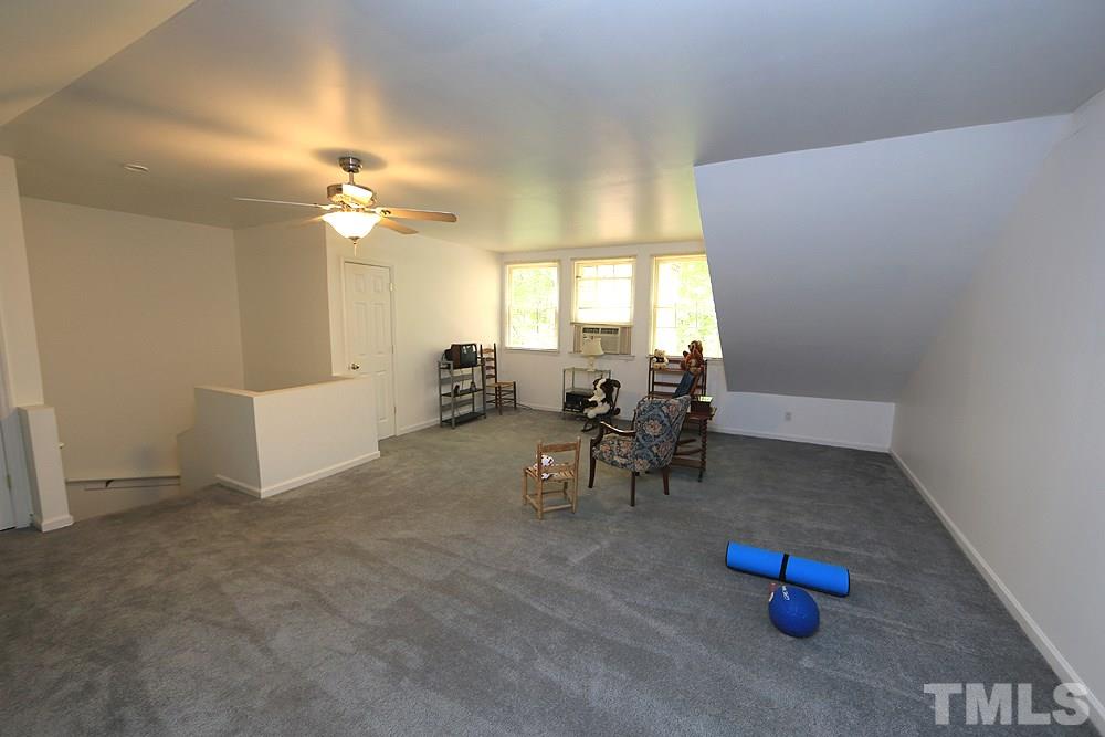 608 Weathergreen Drive Raleigh, NC 27615 - Photo 21 of 25 wooden floor with table and chairs in it