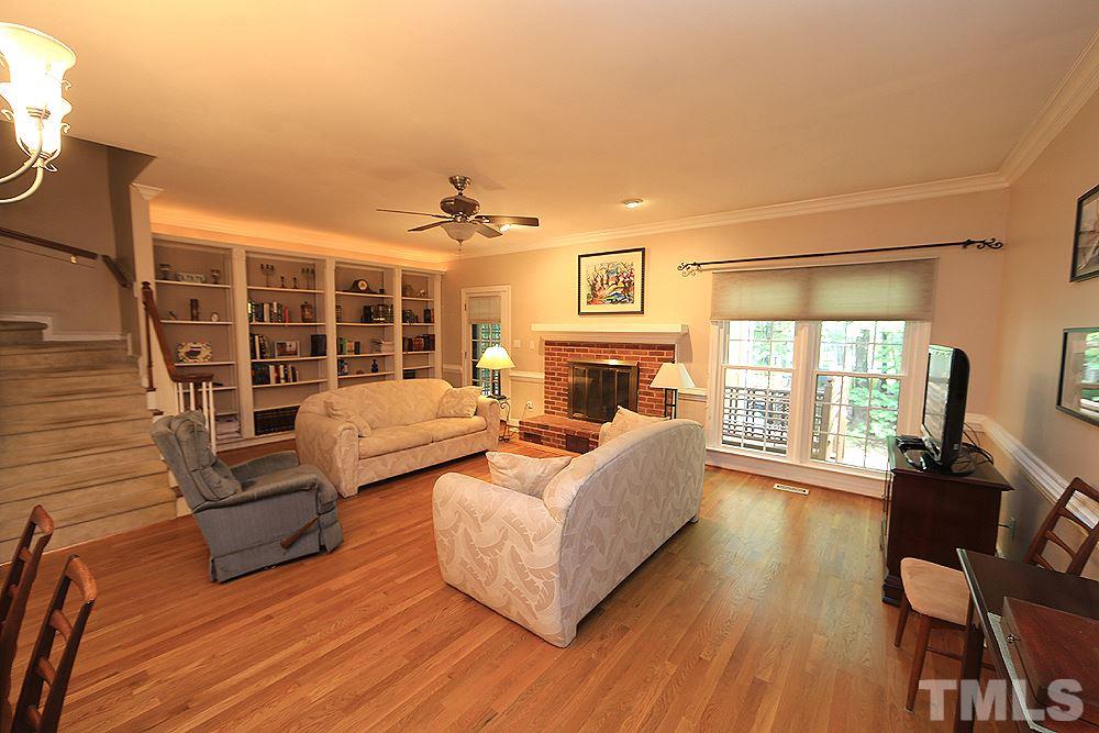 608 Weathergreen Drive Raleigh, NC 27615 - Photo 10 of 25 a living room with furniture fireplace and flat screen tv
