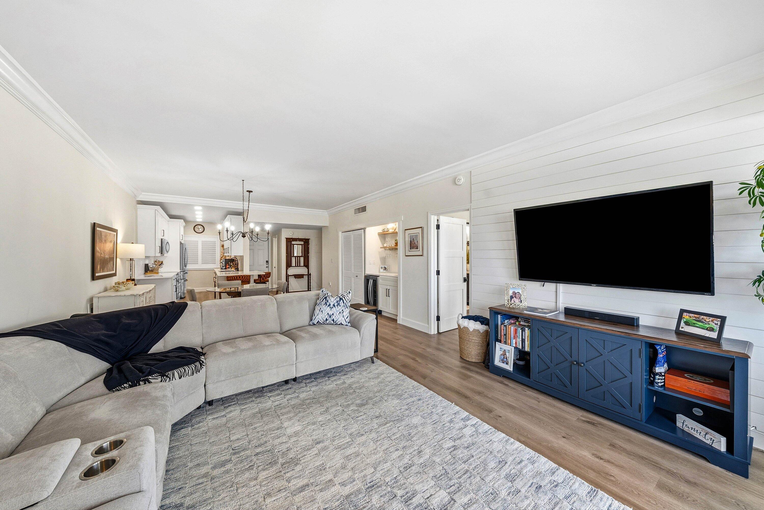 3051 South Ocean Boulevard, Unit 2050 Boca Raton, FL 33432 - Photo 13 of 32 a living room with furniture and a flat screen tv