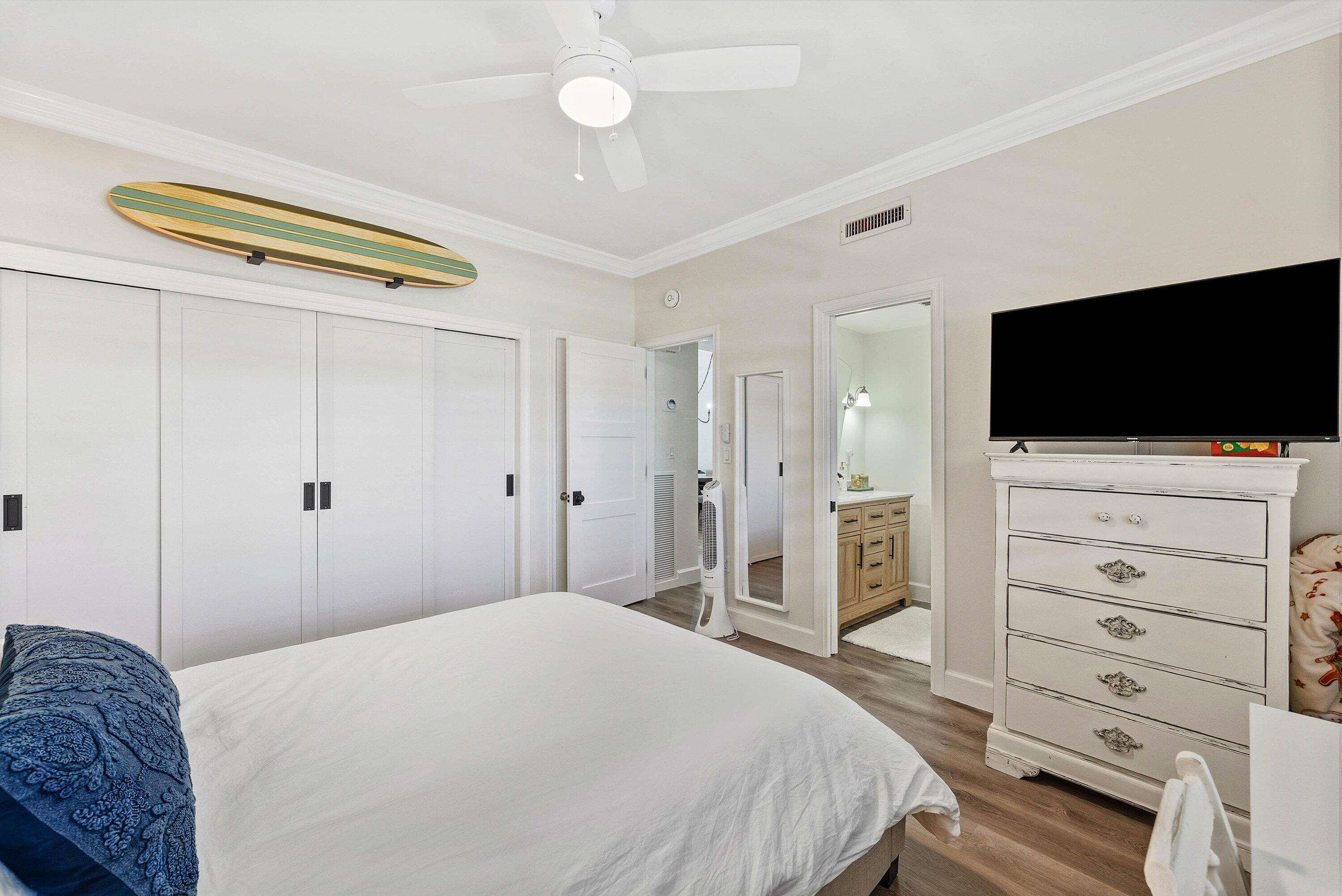 3051 South Ocean Boulevard, Unit 2050 Boca Raton, FL 33432 - Photo 20 of 32 a bedroom with a bed and a flat screen tv