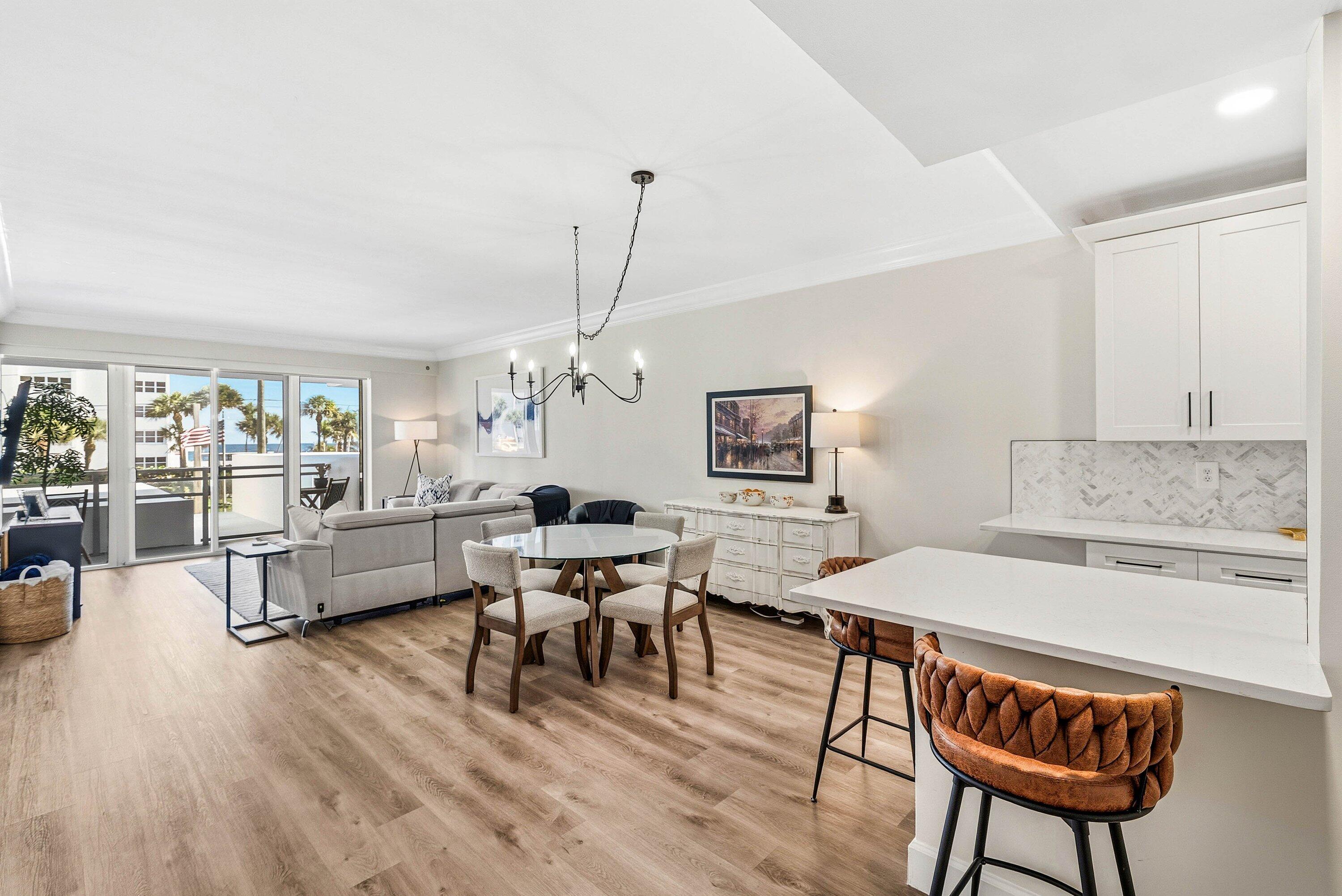 3051 South Ocean Boulevard, Unit 2050 Boca Raton, FL 33432 - Photo 5 of 32 a living room with furniture and a wooden floor