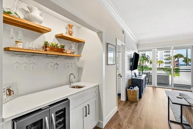 a kitchen with stainless steel appliances a sink a stove and a refrigerator