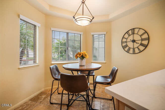 2129 Bermuda Dunes Place Oxnard, CA 93036 - Photo 17 of 42 a view of a dining room with furniture window and wooden floor