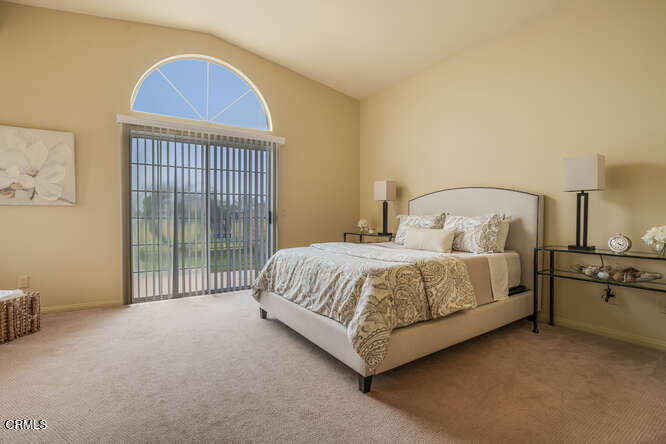 2129 Bermuda Dunes Place Oxnard, CA 93036 - Photo 18 of 42 a spacious bedroom with a bed and a view of en suite bathroom