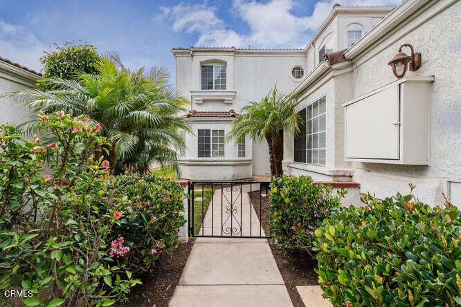 2129 Bermuda Dunes Place Oxnard, CA 93036 - Photo 2 of 42 a view of a house with a flower garden