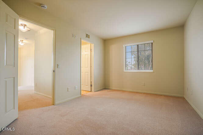 2129 Bermuda Dunes Place Oxnard, CA 93036 - Photo 27 of 42 an empty room with windows and closet