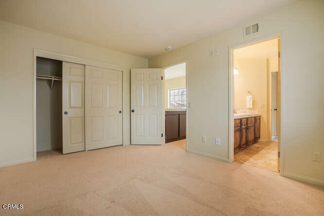 2129 Bermuda Dunes Place Oxnard, CA 93036 - Photo 28 of 42 an empty room with closet and a bathroom