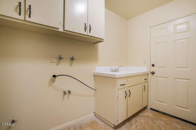 2129 Bermuda Dunes Place Oxnard, CA 93036 - Photo 31 of 42 a bathroom with a sink and mirror