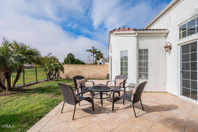 2129 Bermuda Dunes Place Oxnard, CA 93036 - Photo 32 of 42 a view of a chairs and table in backyard of the house
