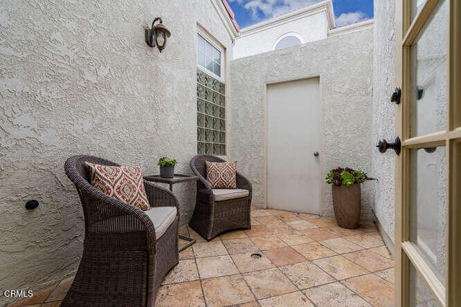2129 Bermuda Dunes Place Oxnard, CA 93036 - Photo 35 of 42 a view of a patio with chair and potted plant