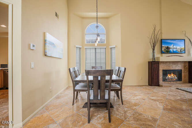2129 Bermuda Dunes Place Oxnard, CA 93036 - Photo 7 of 42 a dining room with furniture and a chandelier