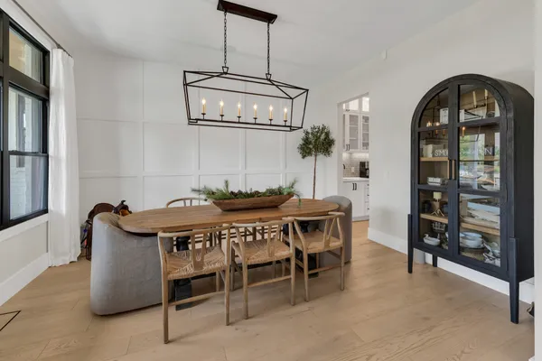 a kitchen with kitchen island stainless steel appliances a sink stove and refrigerator