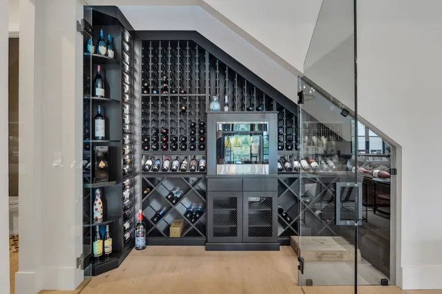 a white toilet sitting next to a white sink