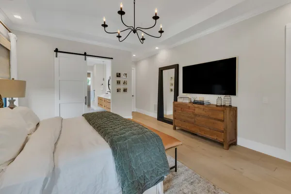 a bedroom with furniture and a window