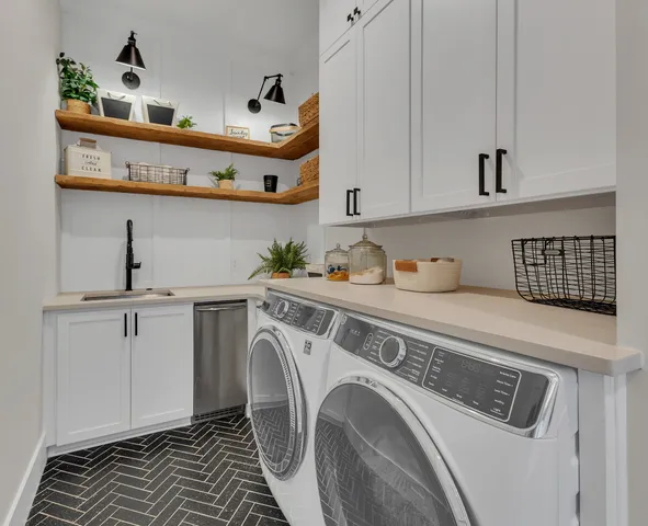 a kitchen with a stove and a wooden floor