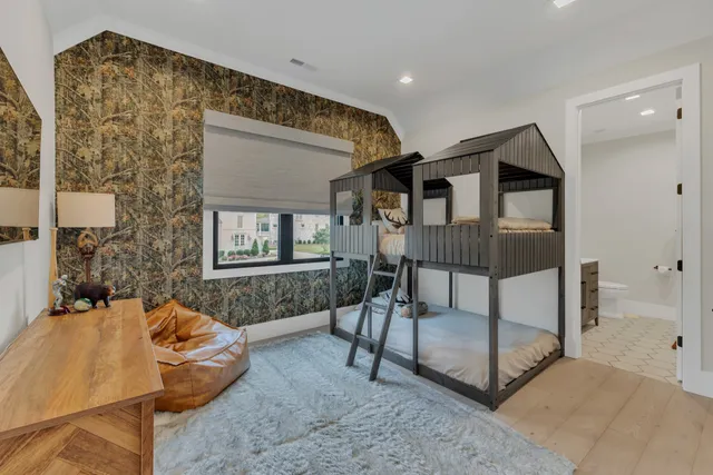 an aerial view of a house with garden space and street view