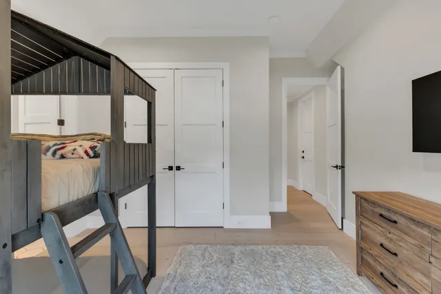 an aerial view of a house with swimming pool garden and mountain view