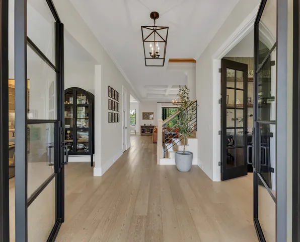 a living room with furniture ceiling fan and a rug