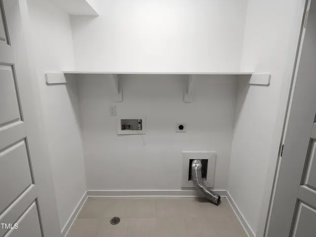 a view of storage and utility room with empty racks