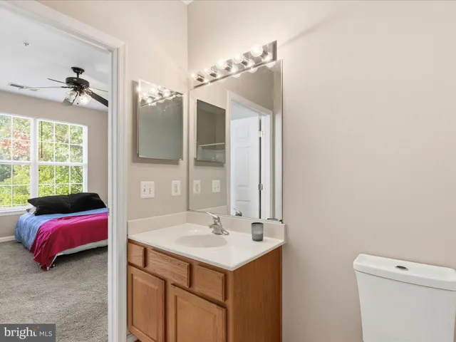 a en suite bathroom with a sink and a mirror