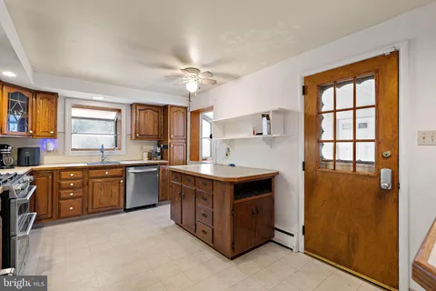 a kitchen with stainless steel appliances granite countertop a stove and a refrigerator