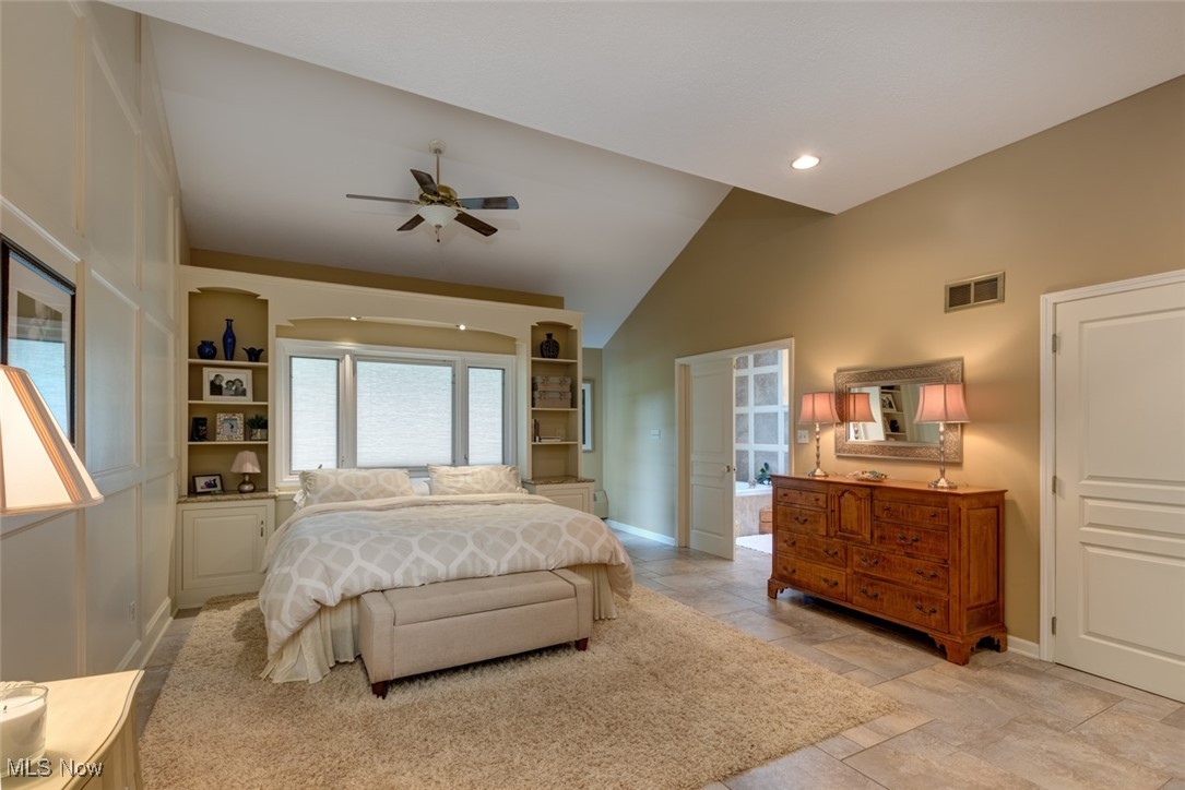 10850 Prouty Road Painesville, OH 44077 - Photo 25 of 50 15x20 Master bedroom boasting vaulted ceiling, carpet and tiled floor, built-in cabinets and a large walk-in closet