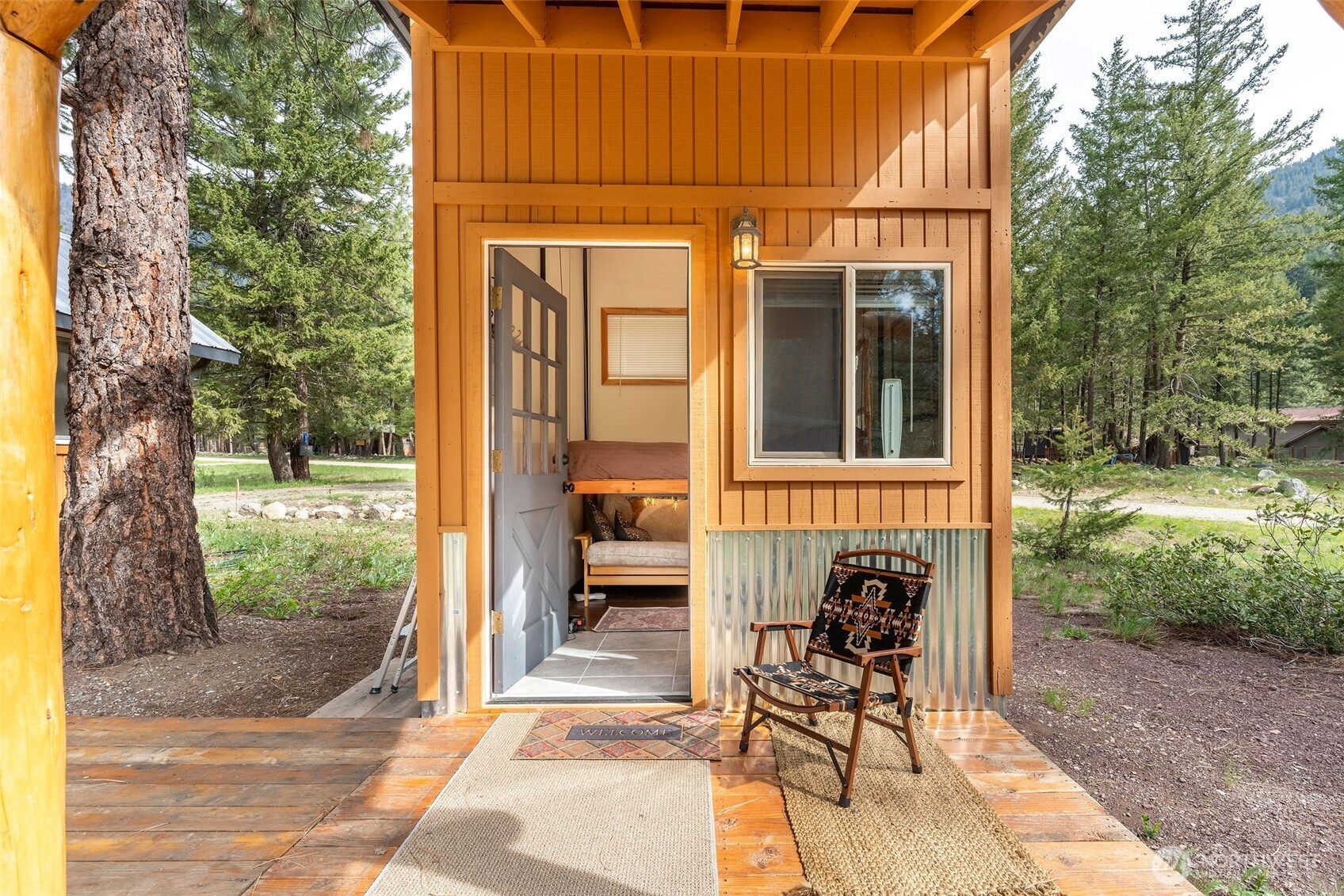 11 Littell Road Mazama, WA 98833 - Photo 2 of 15 a view of a patio with table and chairs and potted plants