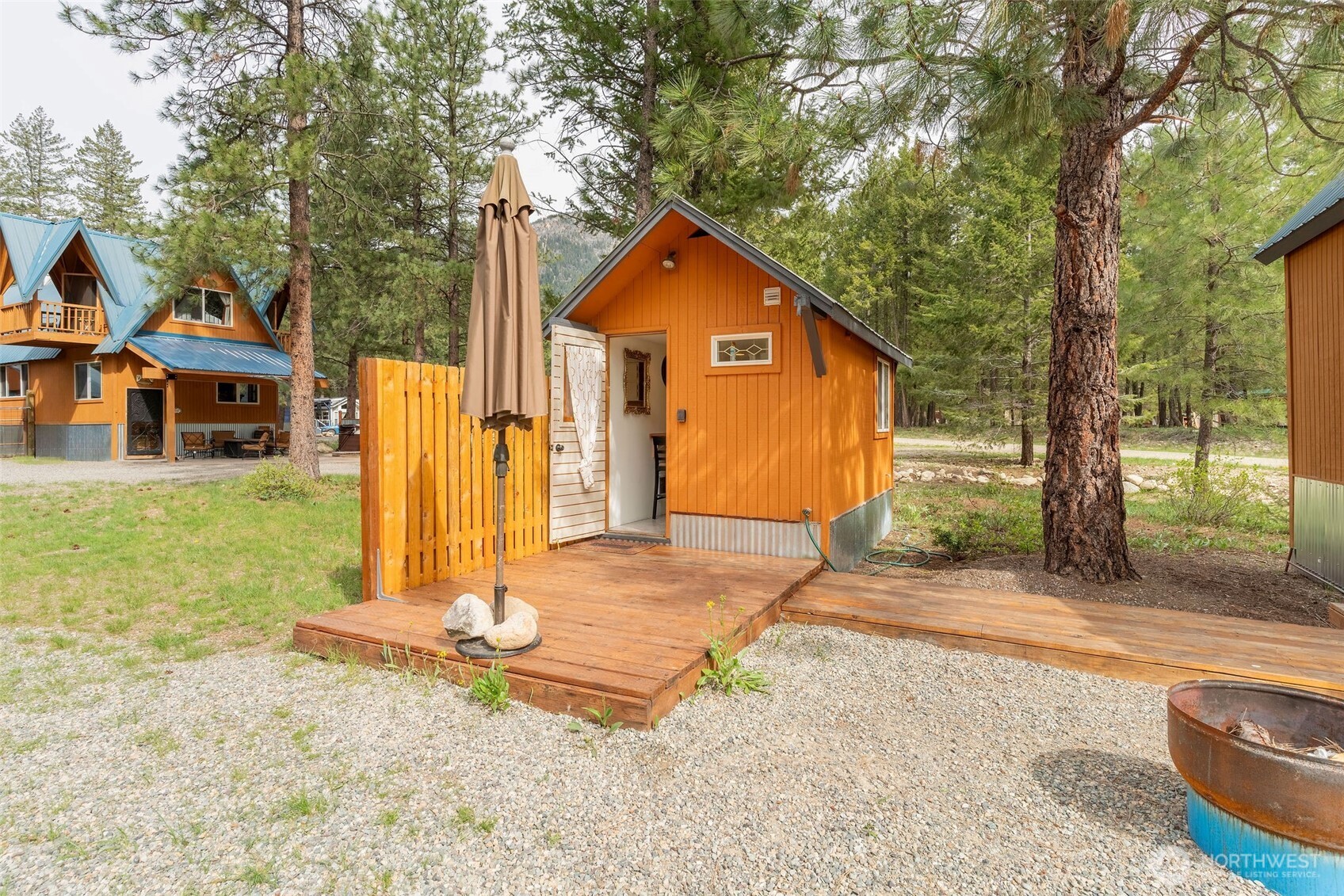 11 Littell Road Mazama, WA 98833 - Photo 7 of 15 a view of a house with backyard and trees