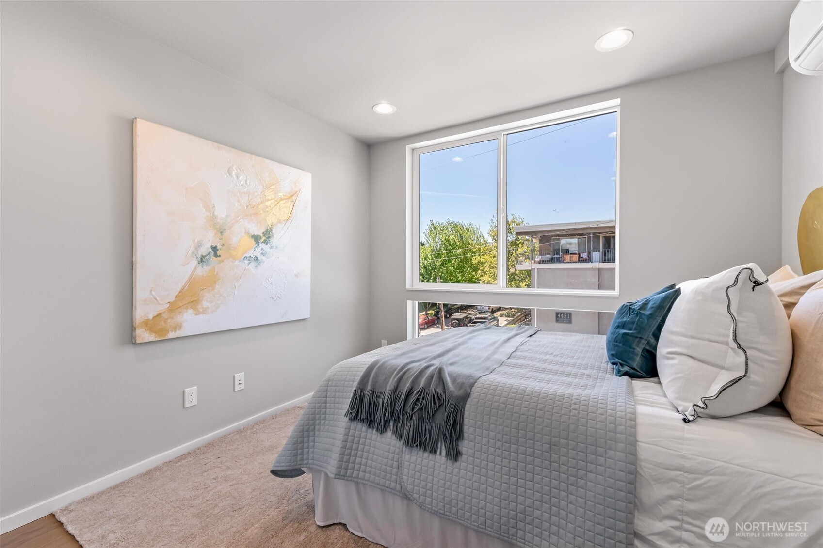 4460 Midvale Avenue North Seattle, WA 98103 - Photo 25 of 40 a bedroom with a large bed and a window