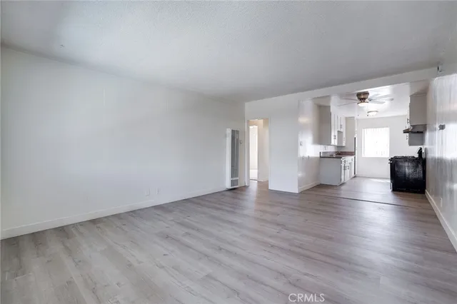 a view of kitchen with furniture and wooden floor