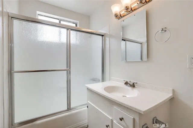 a bathroom with a sink and mirror